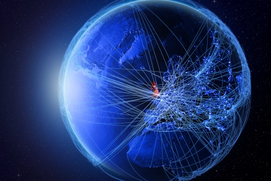 A stylised image of earth taken from space with many thin lines joining cities together